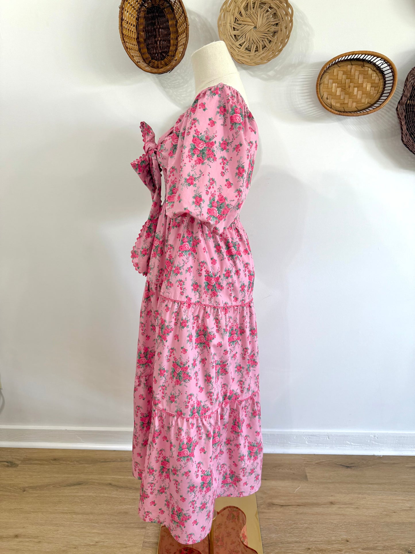 The Everlynn Puff Sleeve Bow Detail Floral Maxi Dress in Pink