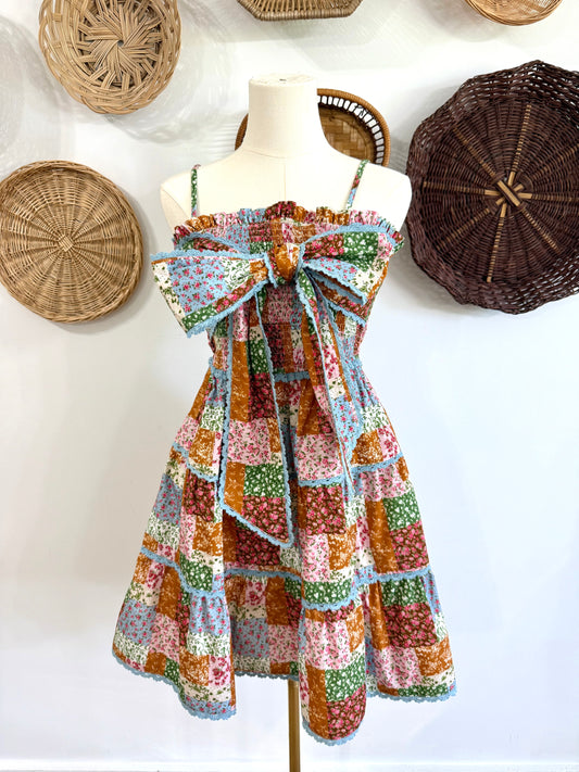 The Ramsey Quilt Patchwork Print Dress with Ric Rac Bow Detail