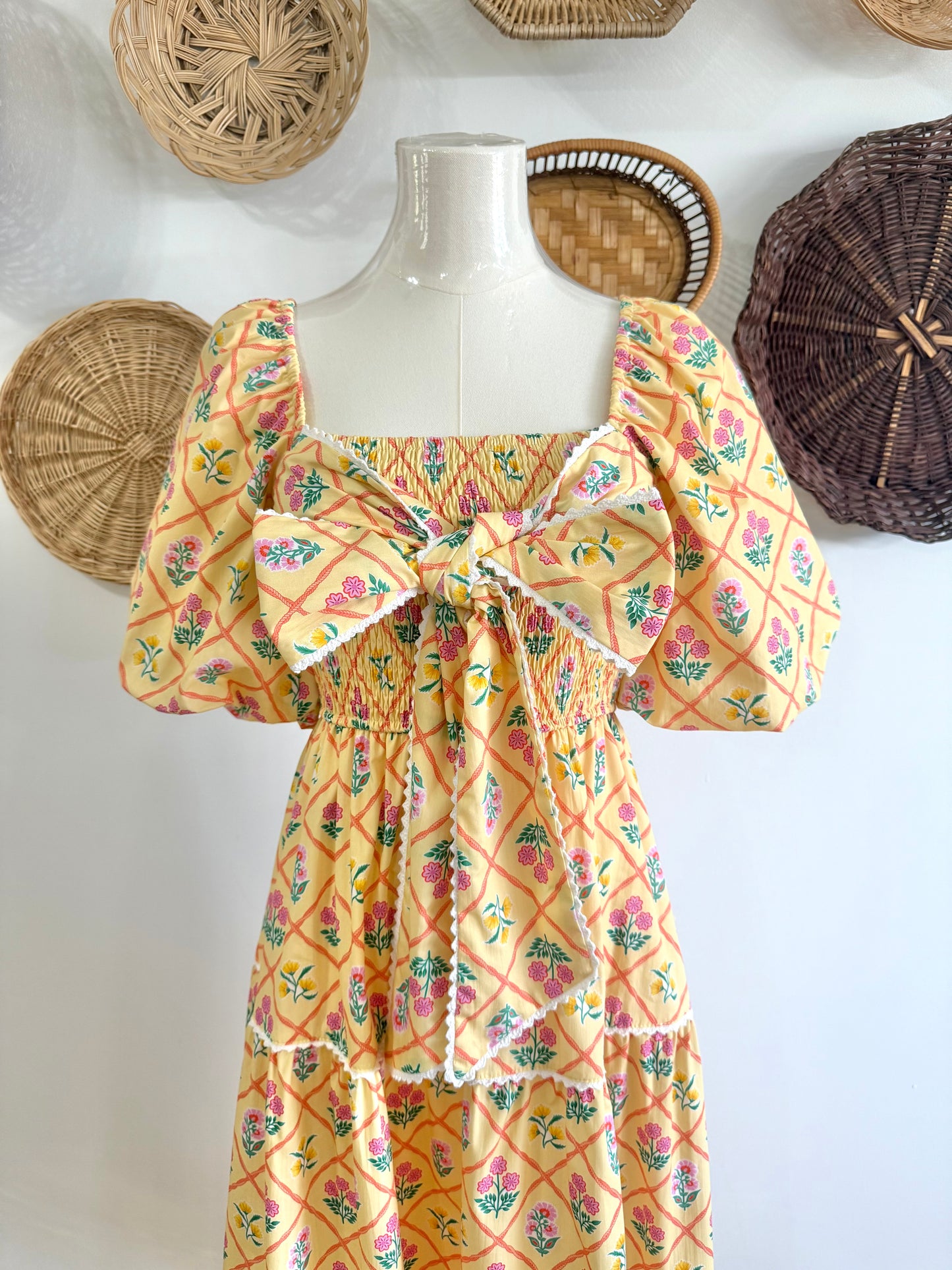 The Everlynn Puff Sleeve Bow Detail Floral Maxi Dress in Yellow