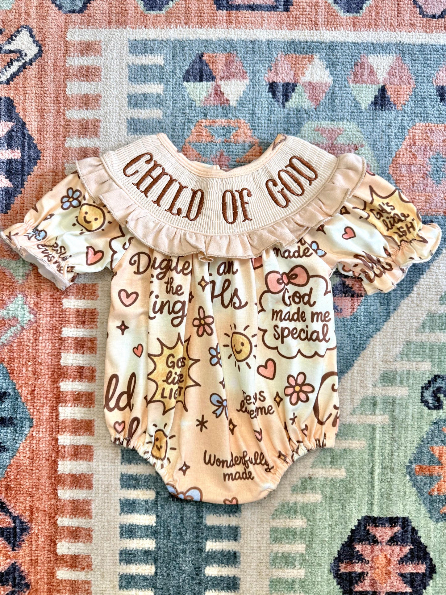 “Child of God” Smocked Ruffle Bubble
