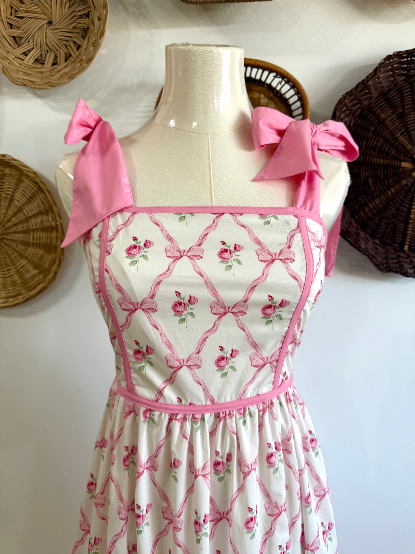The Ava Tie Shoulder Floral & Bow Print Midi Dress in Pink