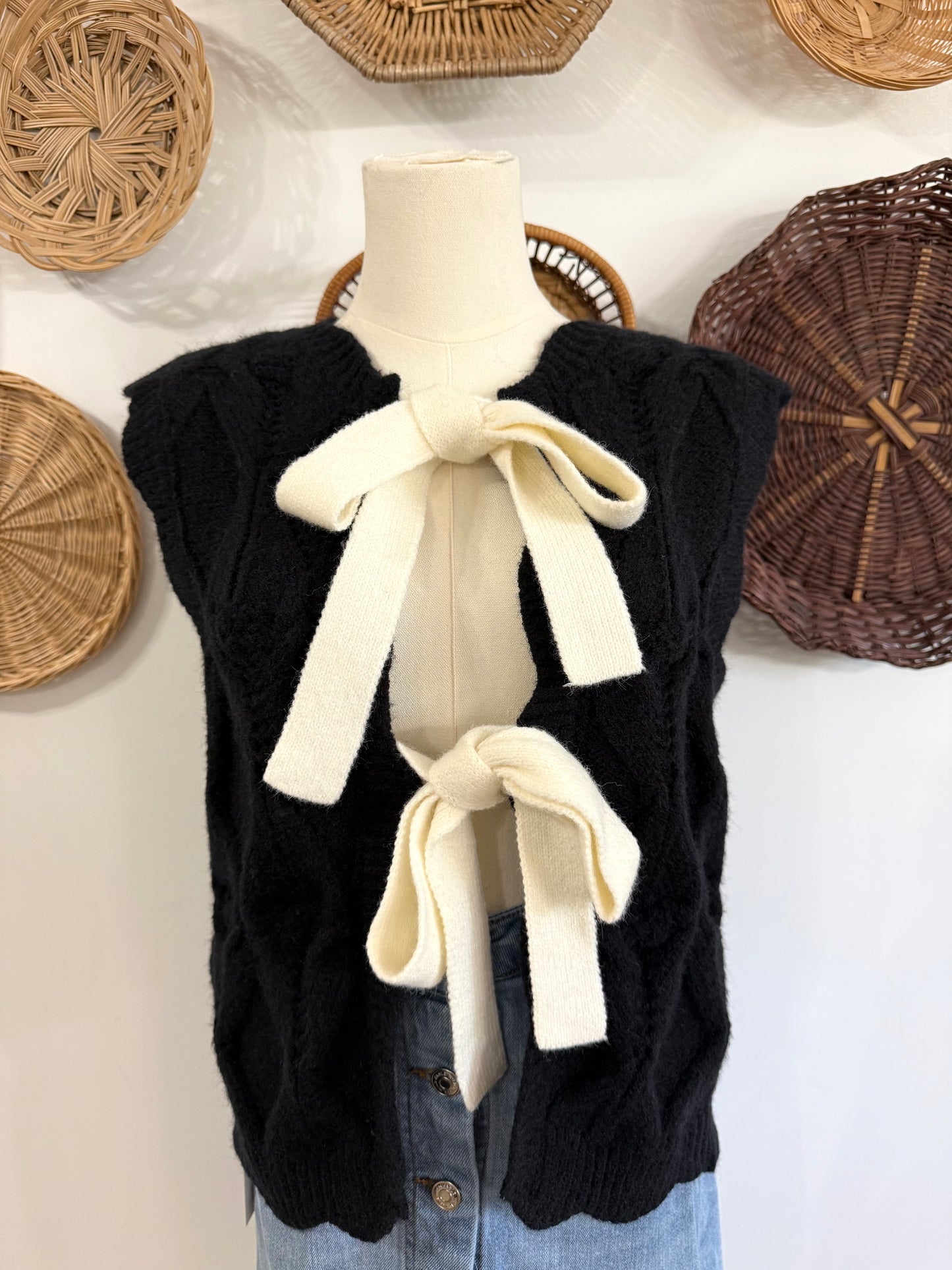 The Truett Scalloped Reversible Sweater Vest with Bows in Black