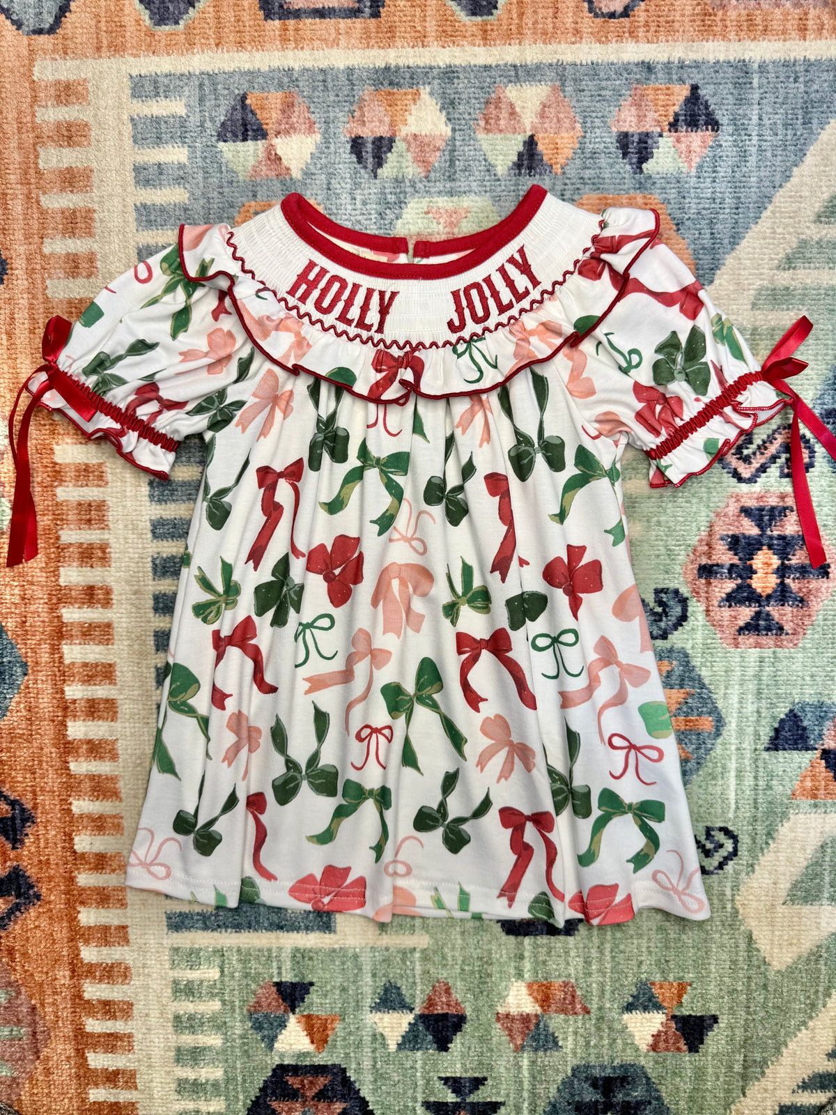 Smocked “Holly Jolly” Ruffle Bow Print Dress