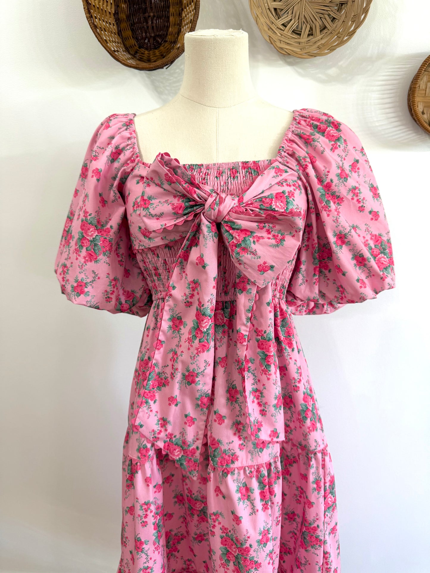 The Everlynn Puff Sleeve Bow Detail Floral Maxi Dress in Pink