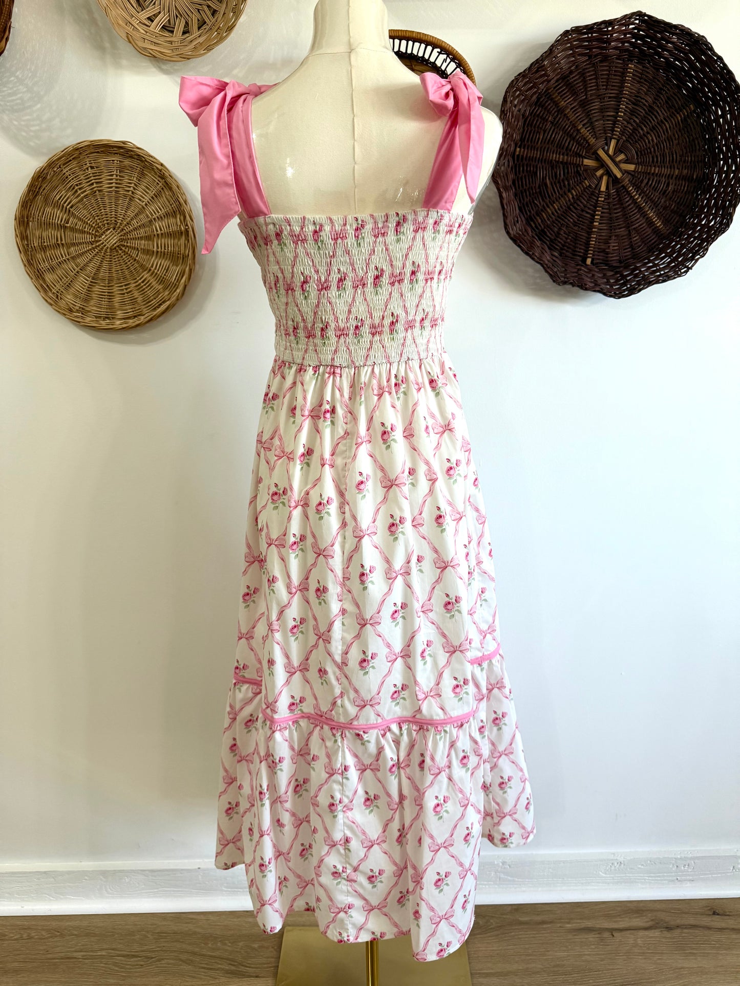 The Ava Tie Shoulder Floral & Bow Print Midi Dress in Pink