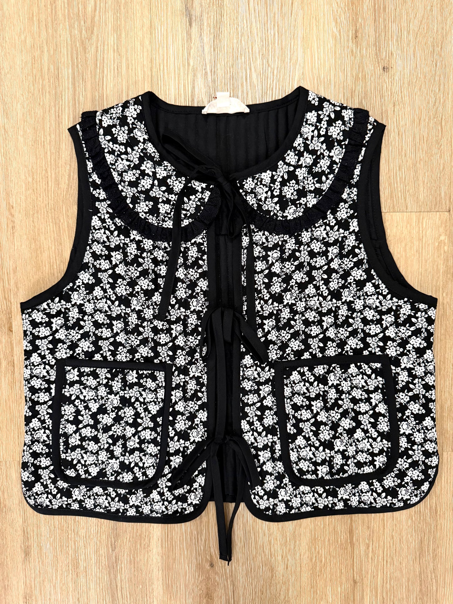 The Arti Bib Collar Floral Vest in Black