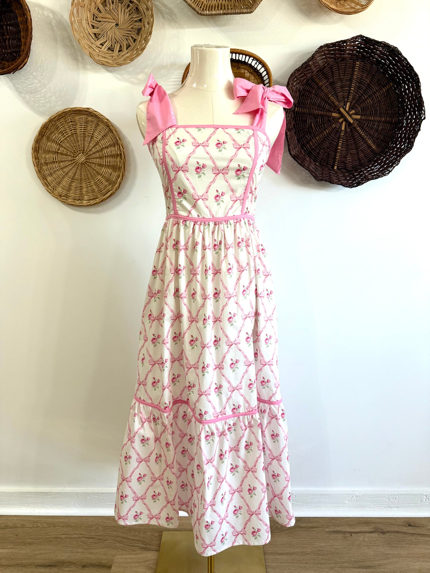 The Ava Tie Shoulder Floral & Bow Print Midi Dress in Pink