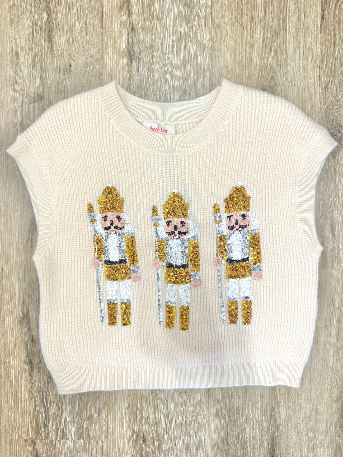 The Tinsel Sequin Nutcracker Sweater Vest in Cream